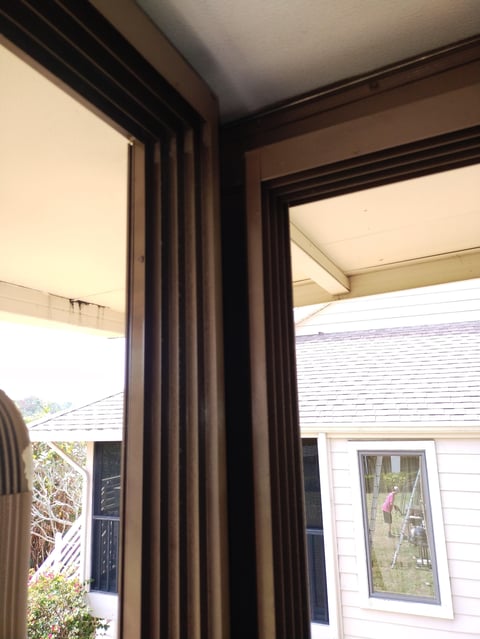 Modern patio pergola with dark wood beam ceiling