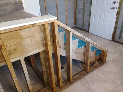 Wooden frame structure under construction in basement
